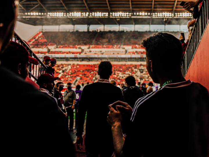 Team Canada players walk through the Toronto stadium tunnel toward a packed crowd